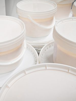 White plastic bucket with paint. . High quality photo