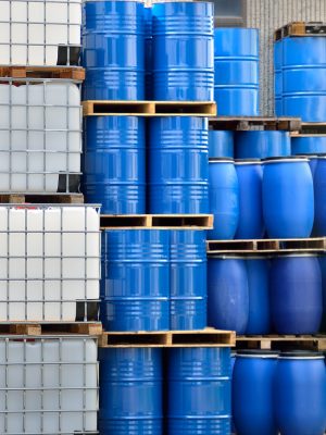 Shot of stacked containers in a large distribution warehouse