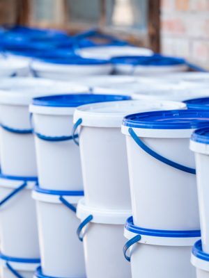 Long rows of buckets with honey collected in long rows, ready to be selled
